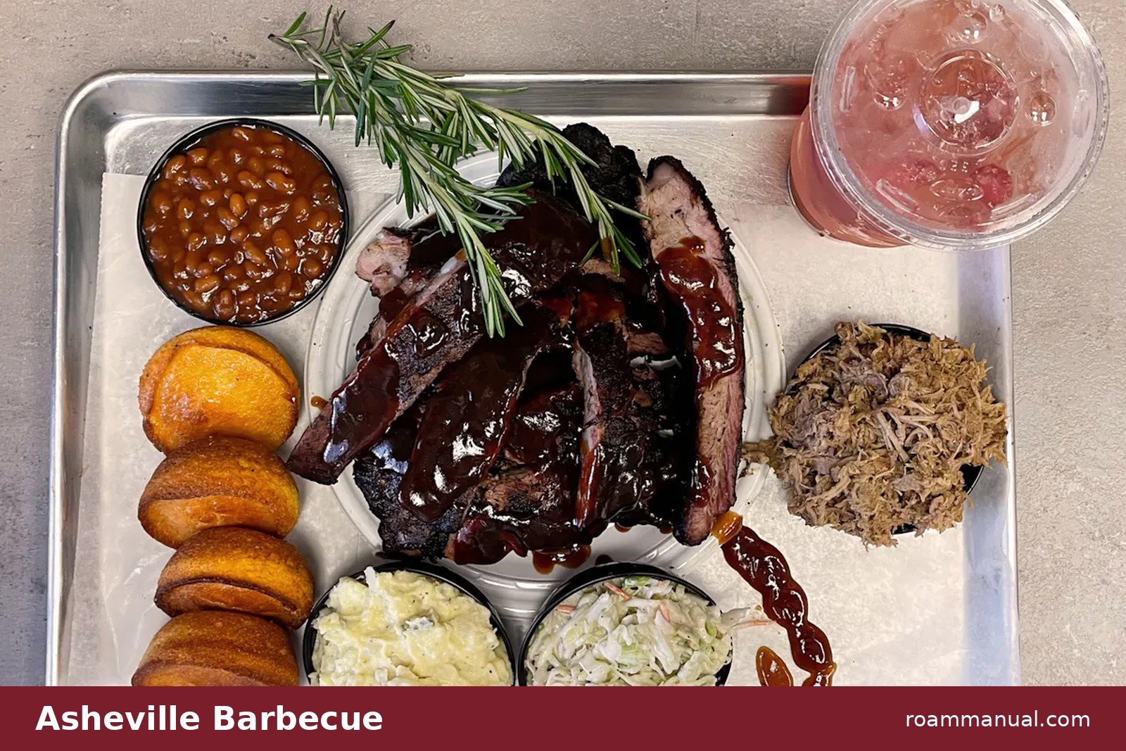 Barbecue tray with sliced ribs, brisket, pulled pork, baked beans, coleslaw, potato salad and cornbread
