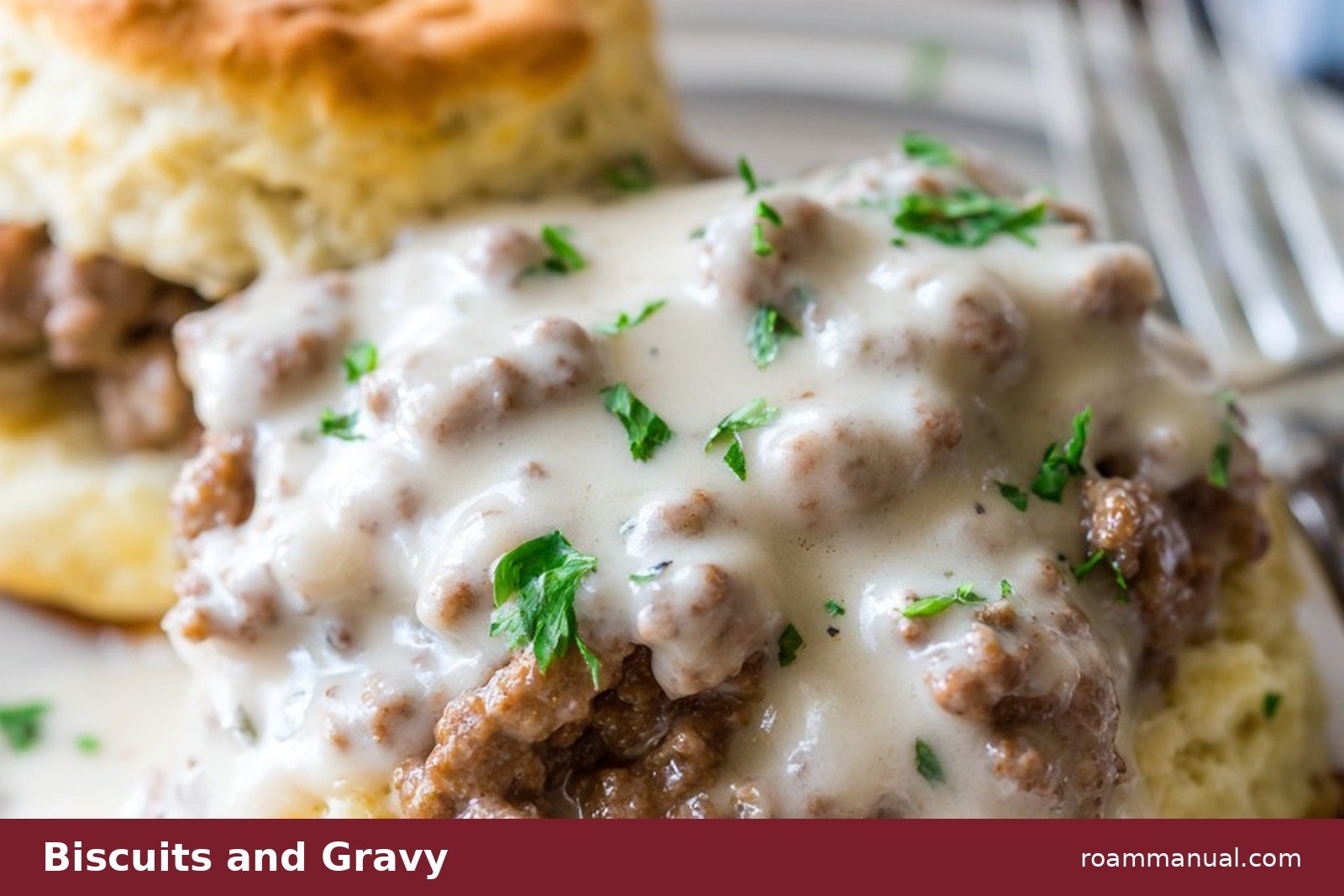 Fluffy buttermilk biscuits covered in sausage gravy on a plate, a classic Southern breakfast in Asheville