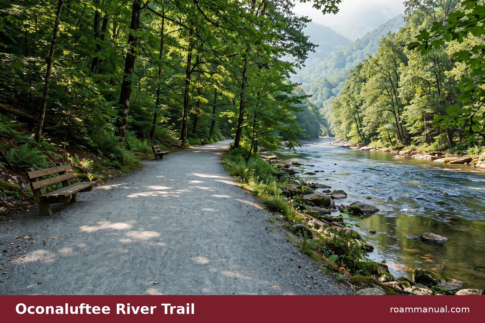 Wide gravel path of the Oconaluftee River Trail running beside the river through green Smoky Mountain forest